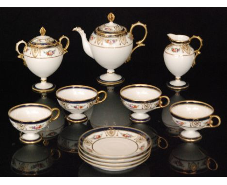 A Noritake teaset comprising pedestal teapot, milk jug, sucrier and four cups and saucers, all decorated with floral sprays w