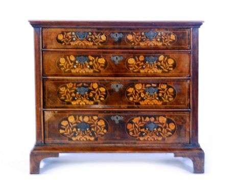 A 20th Century Dutch marquetry walnut chest of four graduated long drawers, profusely inlaid with birds amongst foliage and r