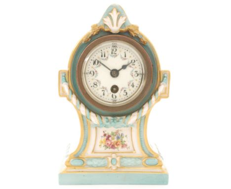An early 20th Century Royal Worcester mantel clock decorated with a floral spray within blue and gilt moulded borders, the di