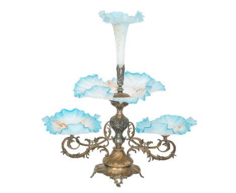 A large late 19th Century table centre epergne with a spelter frame decorated with foliate scroll work and mounted with Conti