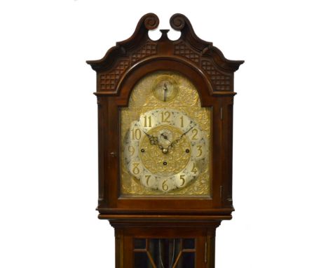 An Arts and Crafts mahogany longcase clock, with three train eight day quarter repeat movement, the hood with twin scroll ped