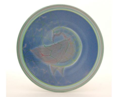 A later 20th Century Poole Studio footed bowl decorated with a stylised bird in tones of blue, green and purple to a design b