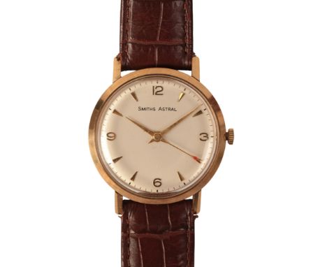 SMITHS ASTRAL: A GENTLEMAN'S 9CT GOLD WRISTWATCH with manual wind movement, the silver dial with gold Arabic and baton numera