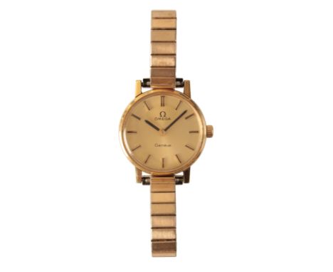 OMEGA GENEVE: A LADY'S GOLD-PLATED WRISTWATCH with manual wind movement, the gold dial with gold and black baton numerals and