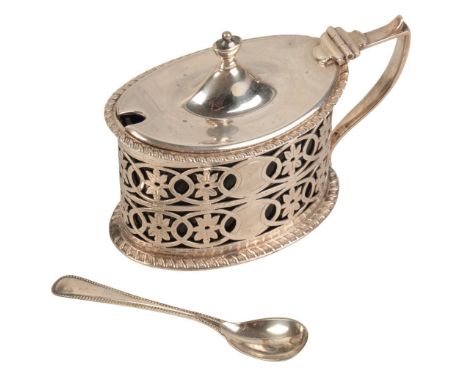 AN EDWARD VII SILVER LIDDED MUSTARD by Haseler Brothers, London 1902, of oval Neo Classical design, with urn finial and flora