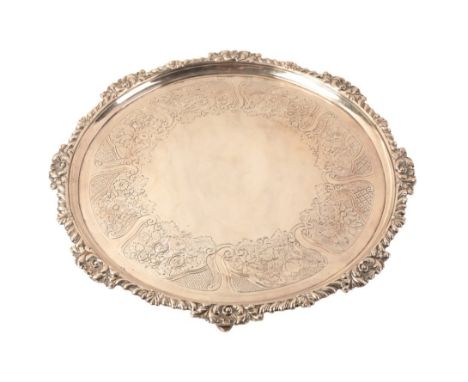 A GEORGE III SILVER CIRCULAR SALVER by John Crouch & Thomas Hannam, London 1781, with leaf cast rim, period leaf engraved cen