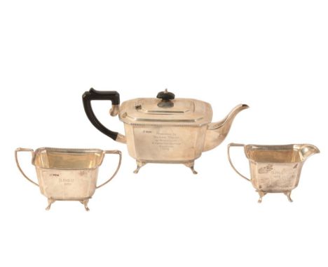 A GEORGE VI SILVER THREE PIECE TEA SERVICE by Francis Howard, Birmingham 1938, of Art Deco shape, the rectangular bodies with