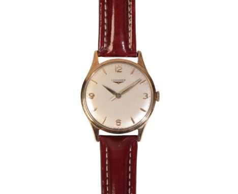 LONGINES: A GENTLEMAN'S 9CT GOLD WRISTWATCH with manual wind movement, the silver dial with gold Arabic and baton numerals an