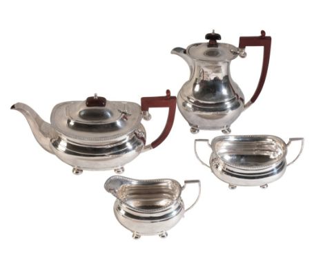 A GEORGE VI SILVER FOUR PIECE TEA SERVICE by Adie Brothers, Birmingham 1941, with gadrooned rims and squat bodies, comprising