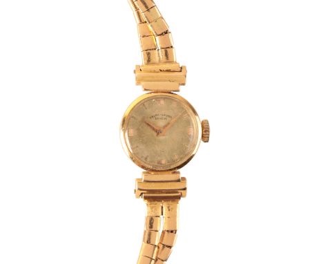 FAVRE-LEUBA: A LADY'S 18CT GOLD BRACELET WATCH with manual wind movement, the gold dial with gold baton numerals and gold han