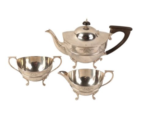 A GEORGE V SILVER THREE PIECE TEA SERVICE probably by William Aitken, Birmingham 1910, comprising teapot, milk jug and sugar 