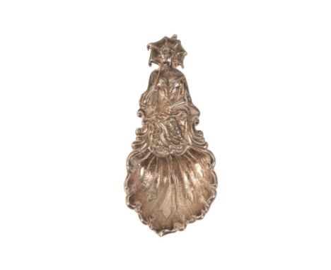 AN ELIZABETH II CAST SILVER CADDY SPOON by Richards &amp; Knight, London 1967, modelled as a lady holding a parasol, 7.5cm lo