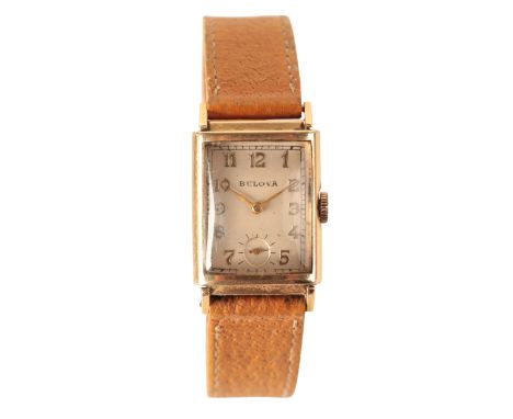 BULOVA: A GENTLEMAN'S 14CT GOLD WRISTWATCH with manual wind movement, the silver rectangular dial with subsidiary seconds dia