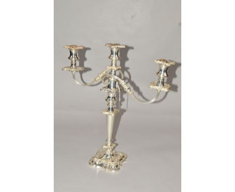 AN ELIZABETH II SILVER THREE LIGHT CANDELABRUM OF VICTORIAN STYLE, shaped square detachable sconces, drip pans, column termin