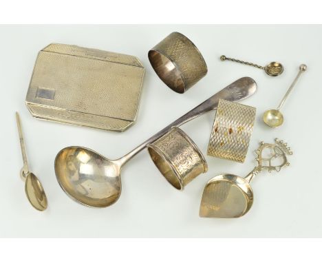 A SELECTION OF SILVERWARE, to include three different napkin rings, a 1930's engine turned cigarette case, two condiment spoo
