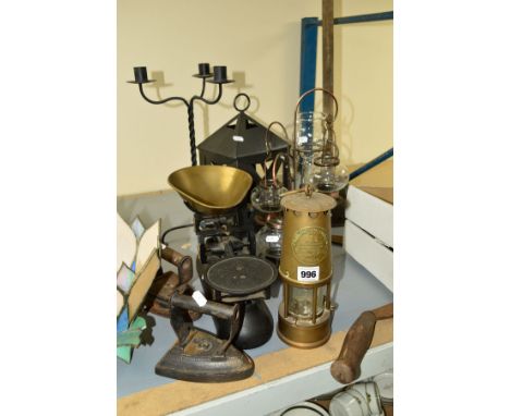 A MINERS SAFETY LAMP, by The Protector Lamp and Lighting Co, Eccles, together with Avery weighing scales, cast iron Victorian