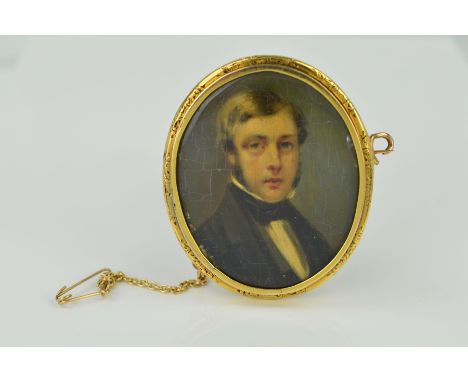 A LATE 19TH CENTURY GOLD PORTRAIT MINIATURE, of an unknown gentleman in classical attire, oval shape measuring approximately 