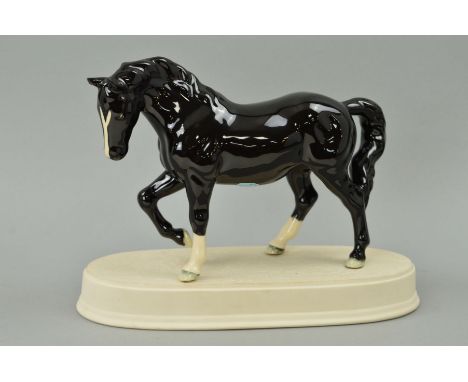 A BESWICK STOCKY JOGGING MARE, No855, 3rd version black colourway BCC gold stamp dated 2005, with ceramic base