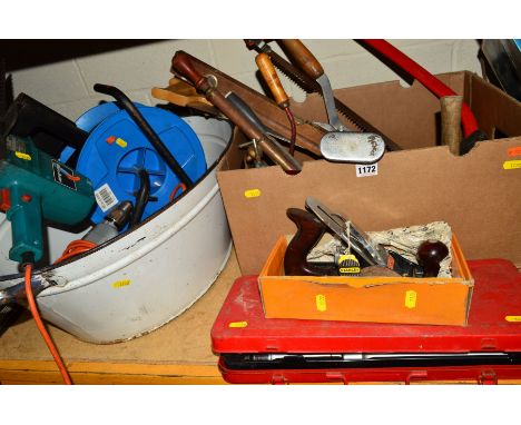 A BOX AND ENAMEL BUCKET CONTAINING A BLACK &amp; DECKER HEDGE TRIMMER, two drills, a cable reel, saw, Workmate and various ot