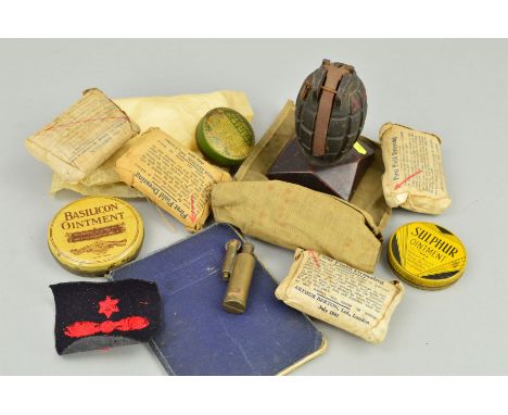 A BRITISH WWI ERA 'MILLS BOMB' GRENADE, mounted on a wooden plinth, all complete and inert, nice example display or desk pape