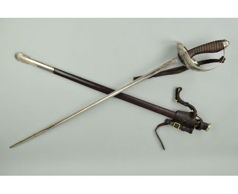 A 1912 PATTERN BRITISH INFANTRY/CAVALRY OFFICERS SWORD BY WILKINSON, complete with leather/metal scabbard and frog attachment