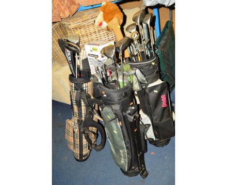 THREE VARIOUS GOLF BAGS, containing various clubs including Us Tour, Penn, Dunlop, etc and a Bikemate bike repair stand (4) 