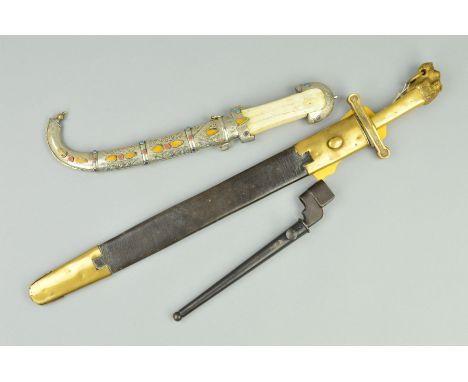 AN EASTERN STYLE POSSIBLY ARABIC SHORT HAND DAGGER, with ornate grip and white metal scabbard (Tourist style piece) WWII era 