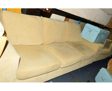 A LIGHT YELLOW UPHOLSTERED THREE PIECE LOUNGE SUITE, comprising of a three seater settee and two armchairs (3)