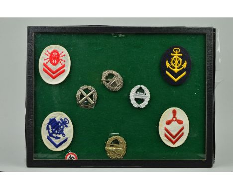 A GLAZED FRAME, (sealed), containing a number of German WWII Kriegsmarine Arm patches for various specialities, i.e. Electric