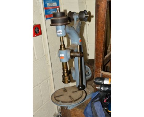 A MANUAL BENCH TOP DRILL PRESS, (losses)