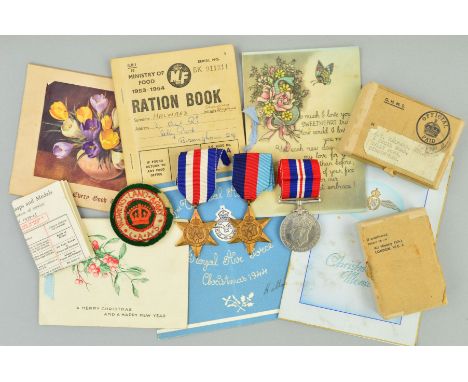 A BOXED GROUP OF WWII MEDALS, attributed to a member of the R.A.F. (D. T. Halward), together with several interesting cards a