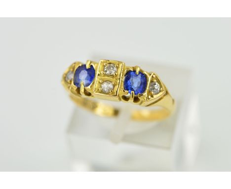 A VICTORIAN 18CT GOLD SAPPHIRE AND DIAMOND HALF HOOP RING, two cushion cut sapphires, measuring approximately 4mm x 3mm, esti