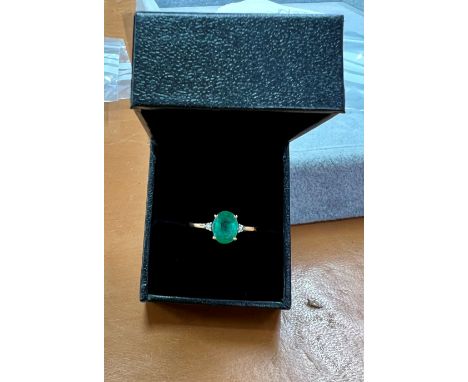 An 18ct yellow gold diamond and emerald ring, size Q.