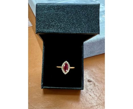 An 18ct yellow gold diamond and ruby ring, size Q.