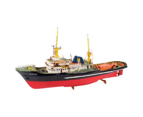 A remote-controlled scratch-built scale model of The Zwarteezee, an ocean-going motortug.  The ocean-going model originally c