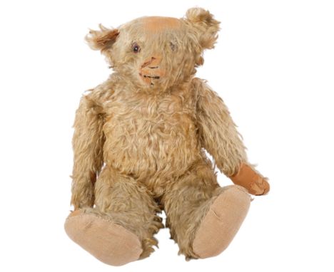 A Vintage long blond haired teddy bear (worn condition), 1 eye detached but present, L60cm