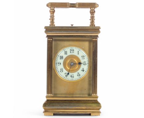 A French brass-cased repeating carriage clock, with lever striking movement, white enamelled dial with hinged carrying handle