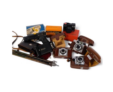 A group of various cameras, including a Franka, an Agfa Kodak folding camera, a telescopic tripod, and a Belltoy pistol, etc