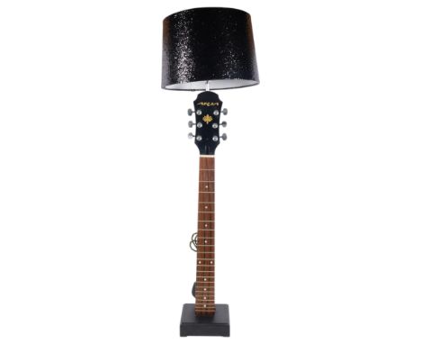 A table lamp fashioned from part of a guitar, with shade, H68cm