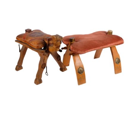 A Vintage carved wood camel saddle design stool, with leather cushion, H43cm, and another stool of similar design