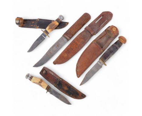 A group of knives, including a Bushman hunting knife, with woven leather strap, and sheath (unrelated), 2 small horn-handled 