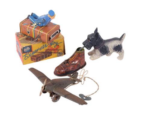 2 Vintage tinplate wind-up toys, including a German Express Bell Hop, boxed, a Scottie dog with a shoe, and a German DRGM key