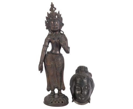 A South East Asian Buddhist patinated bronze standing deity Goddess Tara, H49cm, and a modern Buddhist wall mask (2)