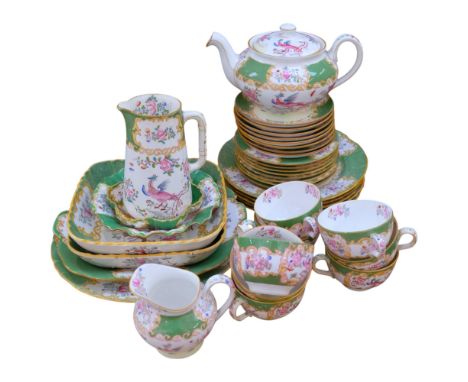 Vintage Minton tea service for 8 people, including teapot and serving plates, with bird of paradise and floral decoration on 
