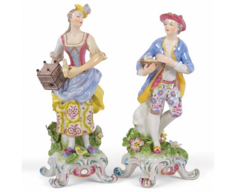 A pair of Antique Continental porcelain figures, red painted dagger and anchor markers to base, 19cmFemale - broken and resto