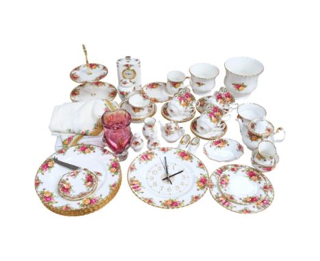 Royal Albert Old Country Roses teaware, dinnerware, wall clock, mantel clock, table cloth, etc, and an Art glass vase