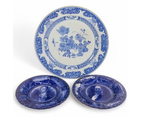 A pair of Staffordshire portrait plaques, depicting Burns and Dickens, and a Japanese blue and white charger, 38cmBlue and wh