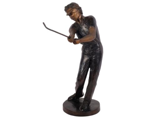 A bronze figure of a golfer, 35.5cm