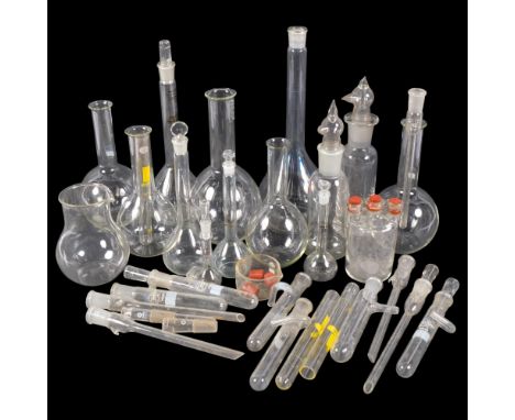 A collection of Vintage scientific laboratory glass flasks and test tubes