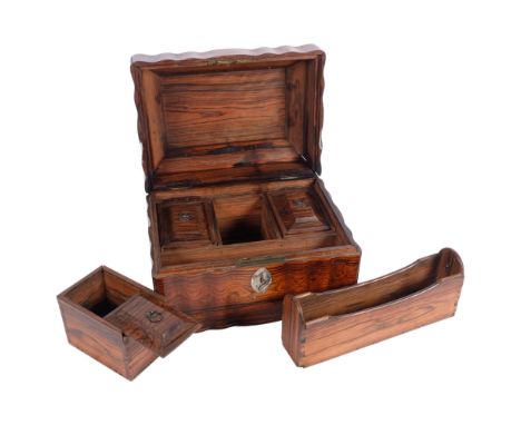 An Anglo-Indian coromandel wood sarcophagus tea caddy box, shaped rectangular form with navette escutcheon and fitted compart